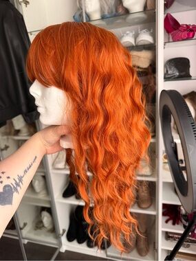 Vibrant Orange Wavy Women's Wig - Curtain Bangs
